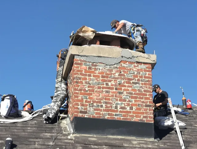 Swansea Chimney Sweep installing a custom chimney crown in Swansea, MA