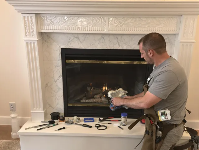 Swansea Chimney Sweep performing fireplace maintenance in Swansea, MA