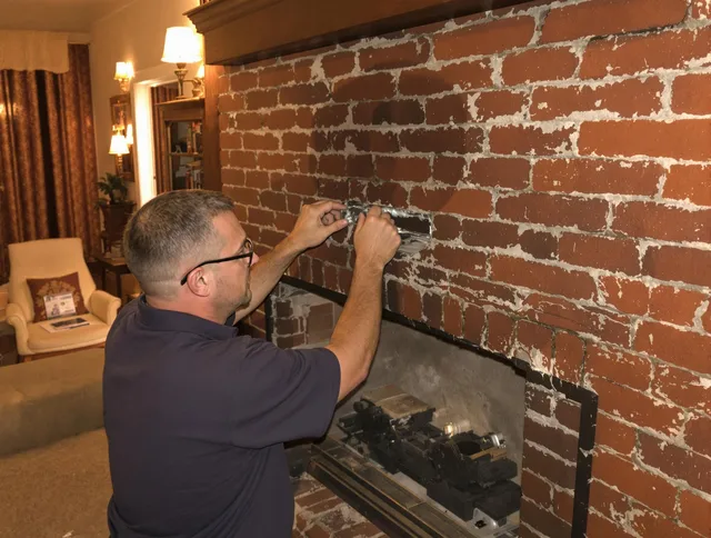 Swansea Chimney Sweep expert fixing a fireplace in Swansea, MA